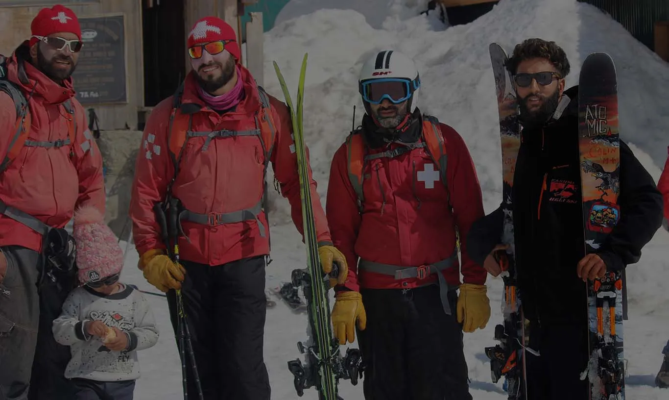 Kashmir Ski School guide with guests in the backcountry
